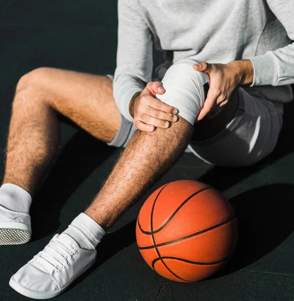 Physiotherapist assessing and treating a patient's knee pain at Sport-Fit Physio Care, Chennai